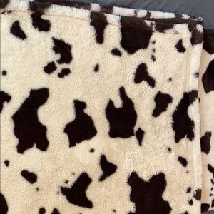 Cow blanket has a pocket for you feet to go in